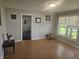 Spacious living room featuring neutral walls, wood floors, and natural light from the window at 705 S 450 E, Franklin, IN 46131