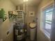 Functional utility room with water heater and water softener at 705 S 450 E, Franklin, IN 46131
