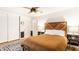 Cozy bedroom with a wood headboard, wood floors, and ample natural light at 7110 N Layman Ave, Indianapolis, IN 46250