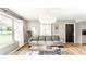 Cozy living room with ample natural light, plush sofa, and stylish decor at 7110 N Layman Ave, Indianapolis, IN 46250