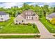 Aerial view of brick home showing the landscaping, driveway, and nearby street at 720 Willow Pointe North Dr, Plainfield, IN 46168