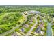 An aerial view of the neighborhood with its shopping center, streets, and houses at 720 Willow Pointe North Dr, Plainfield, IN 46168