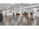 Finished basement featuring a bar with wooden stools and a seating area with black leather chairs at 720 Willow Pointe North Dr, Plainfield, IN 46168