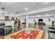 Spacious basement with a bar, seating area with plush chairs, and adjacent workout space at 720 Willow Pointe North Dr, Plainfield, IN 46168