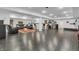 Spacious finished basement with tiled floors, bar area, and a comfortable seating area at 720 Willow Pointe North Dr, Plainfield, IN 46168