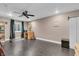 Finished basement area with sleek tile flooring, a built-in bookshelf and ample space for activities at 720 Willow Pointe North Dr, Plainfield, IN 46168