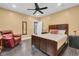 Inviting bedroom with a plush bed, a classic leather recliner and wood-look tile flooring at 720 Willow Pointe North Dr, Plainfield, IN 46168