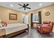 Comfortable bedroom with a ceiling fan, a leather recliner and a well-lit closet at 720 Willow Pointe North Dr, Plainfield, IN 46168