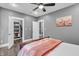 Cozy bedroom featuring a ceiling fan, hardwood floors, and a closet at 720 Willow Pointe North Dr, Plainfield, IN 46168