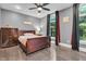 Comfortable bedroom with ceiling fan, hardwood floors, and large windows at 720 Willow Pointe North Dr, Plainfield, IN 46168