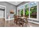 Inviting dining area with a wood table, large windows, and natural light at 720 Willow Pointe North Dr, Plainfield, IN 46168