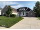 Stunning home with a three-car garage and a concrete driveway at 720 Willow Pointe North Dr, Plainfield, IN 46168