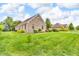 A beautiful brick house with well-maintained lawn and landscaping adds curb appeal at 720 Willow Pointe North Dr, Plainfield, IN 46168