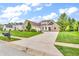 Charming home featuring a well-manicured lawn and a paved driveway leading to a three-car garage at 720 Willow Pointe North Dr, Plainfield, IN 46168