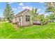 Brick house with a wooden deck and lush lawn presents an inviting exterior at 720 Willow Pointe North Dr, Plainfield, IN 46168