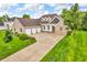 Beautiful brick home with a large driveway and lush landscaping at 720 Willow Pointe North Dr, Plainfield, IN 46168
