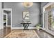 Elegant foyer features gleaming hardwood floors and stylish decor at 720 Willow Pointe North Dr, Plainfield, IN 46168
