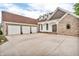 Home features a three car garage and long driveway at 720 Willow Pointe North Dr, Plainfield, IN 46168