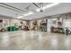 Spacious garage featuring multiple storage shelves, ample lighting and space for vehicles and equipment at 720 Willow Pointe North Dr, Plainfield, IN 46168