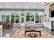 Bright living room with large windows offering a view of the landscaped backyard at 720 Willow Pointe North Dr, Plainfield, IN 46168