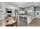 Spacious living area with a kitchen island, fireplace, and open floor plan at 720 Willow Pointe North Dr, Plainfield, IN 46168