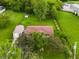 Aerial view of the property highlighting the house, garage, storage shed, and lush greenery at 7214 W Reformatory Rd, Fortville, IN 46040