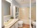 Functional bathroom featuring a vanity, toilet, and tub-shower combo with built-in shelving at 7214 W Reformatory Rd, Fortville, IN 46040