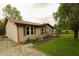 View of the home's side exterior, highlighting the well-manicured lawn and beautiful landscaping at 7214 W Reformatory Rd, Fortville, IN 46040