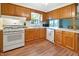 Functional kitchen featuring an oven, countertops, and ample cabinet space, all with views to the dining room at 7214 W Reformatory Rd, Fortville, IN 46040