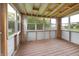 Wood-floored patio with aluminum frame windows allowing natural light and a view of the outdoors at 7214 W Reformatory Rd, Fortville, IN 46040