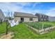 A relaxing backyard with a thriving garden, and an inviting outdoor space at 7238 Moultrie Dr, Indianapolis, IN 46217
