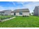 Featuring a well-manicured lawn and garden area, perfect for outdoor enjoyment at 7238 Moultrie Dr, Indianapolis, IN 46217