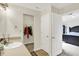 A convenient bathroom with a vanity sink and mirror with attached access to the main bedroom at 7238 Moultrie Dr, Indianapolis, IN 46217