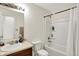 Bright bathroom features a tub and shower combination, a vanity with ample counter space, and neutral finishes at 7238 Moultrie Dr, Indianapolis, IN 46217