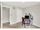 A cozy bedroom with a desk, chair, and ample closet space, perfect for a home office or guest room at 7238 Moultrie Dr, Indianapolis, IN 46217