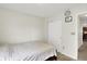 Simple bedroom with minimal furnishings, featuring a clean and organized closet space for storage at 7238 Moultrie Dr, Indianapolis, IN 46217