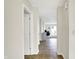 Neutral hallway featuring tile floors and an open view into the carpeted living room at 7238 Moultrie Dr, Indianapolis, IN 46217