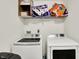 Functional laundry room equipped with modern washer and dryer, providing convenience for laundry tasks at 7238 Moultrie Dr, Indianapolis, IN 46217
