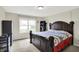 This is a main bedroom with a large window and plenty of natural light and neutral colors at 7238 Moultrie Dr, Indianapolis, IN 46217