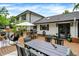 Spacious deck with dining table, BBQ, bar, and stairs leading to backyard at 7255 Haverhill Ct, Indianapolis, IN 46250