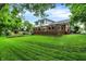 Lush green backyard with a spacious deck, offering ample room for outdoor gatherings and entertaining with serene views at 7255 Haverhill Ct, Indianapolis, IN 46250