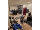 Finished basement with a workout area and bar featuring weights and a red refrigerator, and stylish decor at 7255 Haverhill Ct, Indianapolis, IN 46250