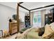 Bedroom with four-poster bed, natural light, and neutral wall color at 7255 Haverhill Ct, Indianapolis, IN 46250