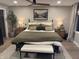 Inviting bedroom featuring a ceiling fan, plush bed, and comfortable seating for a serene retreat at 7255 Haverhill Ct, Indianapolis, IN 46250