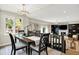 Inviting dining area with a dark wood table, comfortable seating, and stylish lighting fixture at 7255 Haverhill Ct, Indianapolis, IN 46250