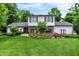 Charming two-story home with a brick and white exterior and a well-maintained landscaped front yard at 7255 Haverhill Ct, Indianapolis, IN 46250