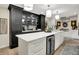Modern kitchen with black cabinets, a large island, white countertops, and stainless steel appliances at 7255 Haverhill Ct, Indianapolis, IN 46250