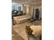 Inviting living area with modern chandelier, features a plush sofa, textured rug, and access to the outdoors at 7255 Haverhill Ct, Indianapolis, IN 46250