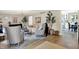 Open concept living area with hardwood floors, stylish decor, and a view of the dining area and kitchen at 7255 Haverhill Ct, Indianapolis, IN 46250