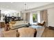 Inviting living room with an open floor plan and sliding glass doors to the patio at 7255 Haverhill Ct, Indianapolis, IN 46250